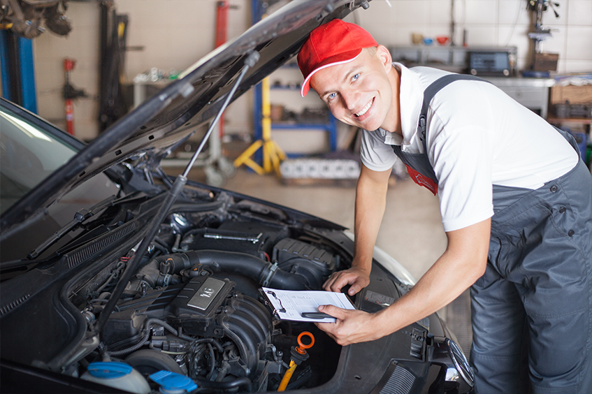 Technician performing an MOT Test after the car was brought in for its MOT Booking